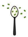 Spoon of sour cream with chopped green onion on white background